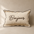 Dekokissen Bonjour in Natur mit brauner Stickerei